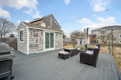The back deck with string lights and the bunk house!