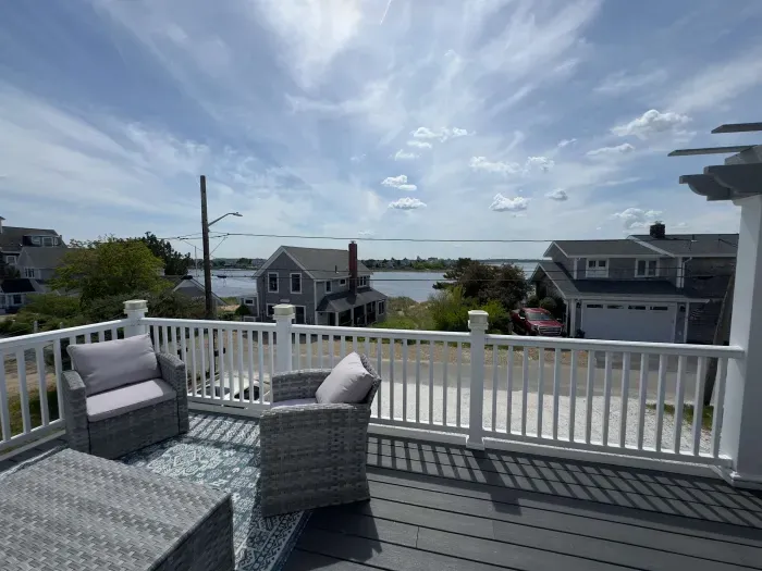 The balcony with outdoor seating, dining, and views of the Plum Island Basin!