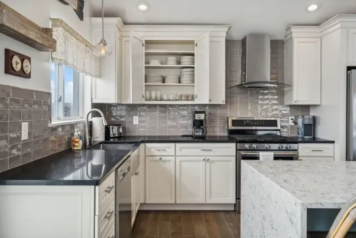 Fully equipped kitchen with all the necessities including flatware and dinnerware 