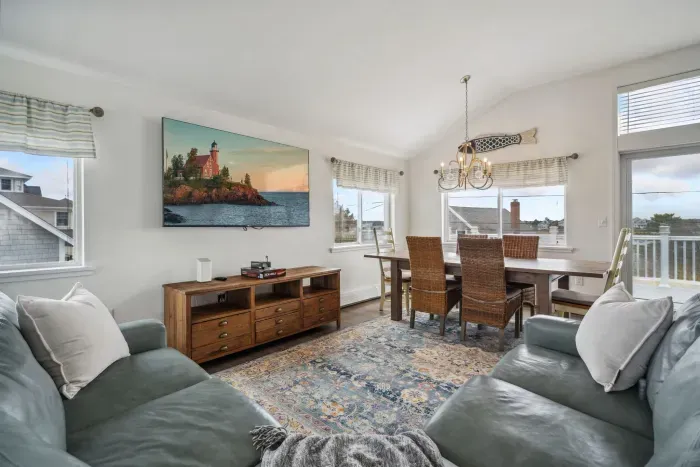 The upstairs living area with a comfy couch and large smart TV