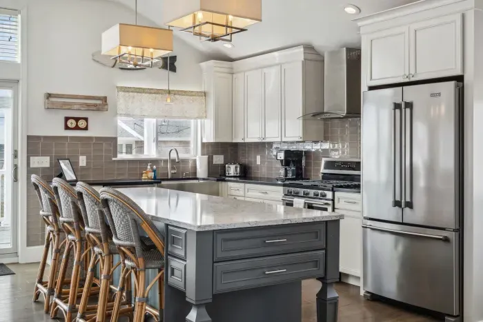 Fully equipped kitchen with all major appliances, waterfall island with seating for 4, and a view of the Plum Island Basin!