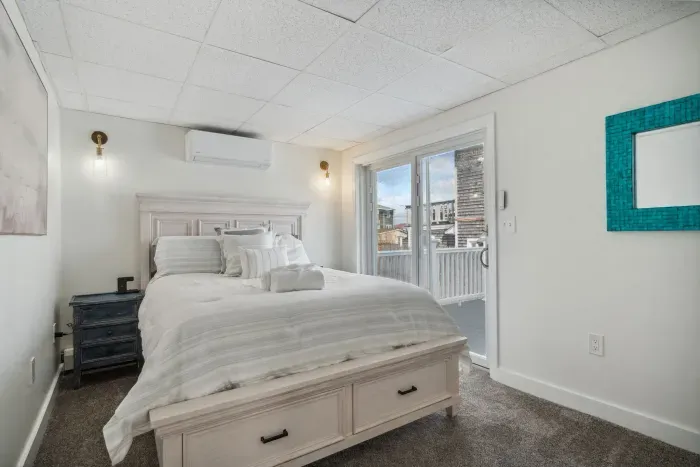 The primary bedroom! With mini split heating and cooling, queen bed, and wireless chargers for all your electronics! Clean linens provided