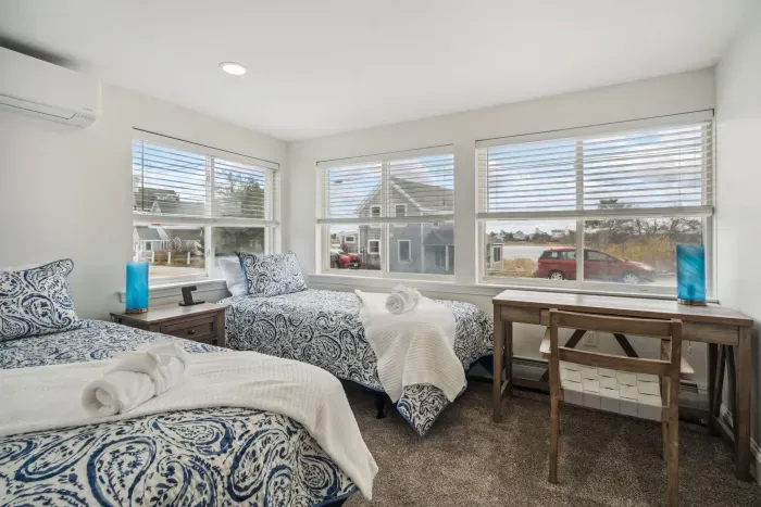 Bedroom #3! With a desk perfect from working from home and two twin beds. Clean linens provided