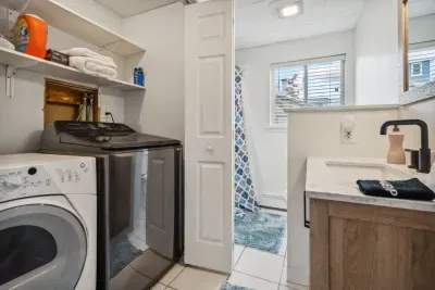 The downstairs bathroom! Full size washer and dryer are in the closet of this first floor bathroom. There is a standing shower in this bathroom. Clean towels provided for all guests