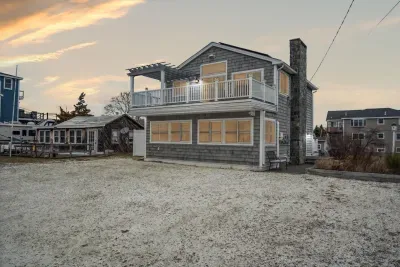Welcome to Plum Time! A 3 bedroom home with incredible views of the Plum Island Basin! Parking for 4 vehicles in the white seashell driveway