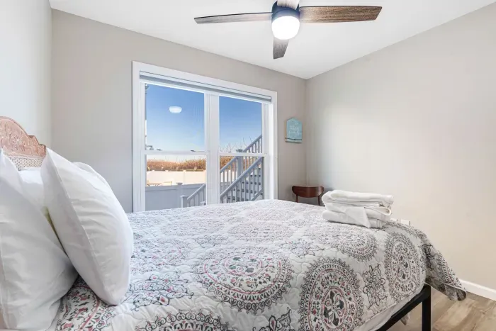 Bedroom 2 with a queen bed. Clean linens provided