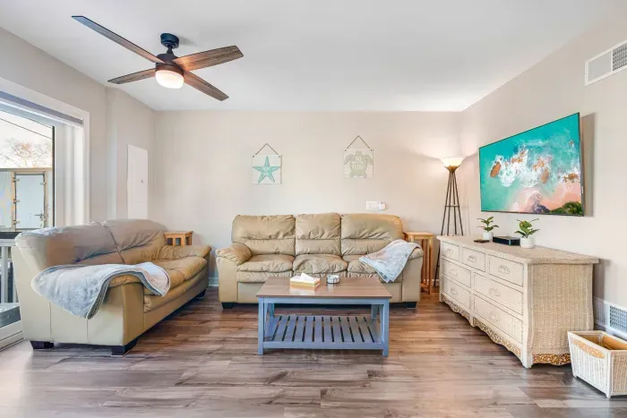 Living room with Queen sleeper and smart TV - access to the driveway is off this room