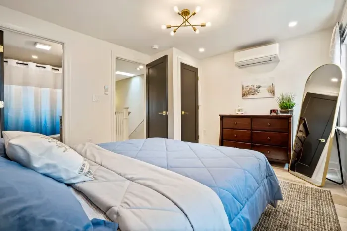 Bedroom #4 features a queen bed, dresser, and full size closet. There is an ensuite bathroom.