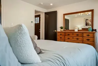 Bedroom #1 has a queen sized bed, full sized closet, and large dresser for storage.