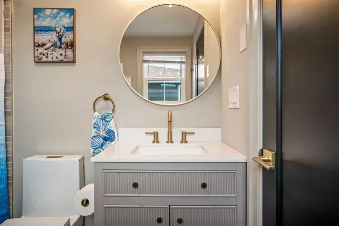 Updated ensuite bathroom off of bedroom #4. Featuring a tub and shower.