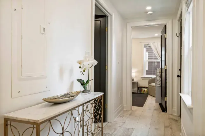 Hallway leading to bathroom 1 and bedroom 2