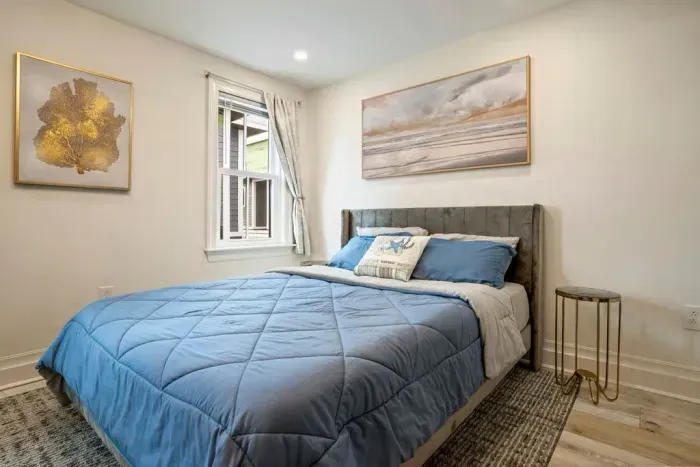 Bedroom #4 features a queen bed, dresser, and full size closet. There is an ensuite bathroom.