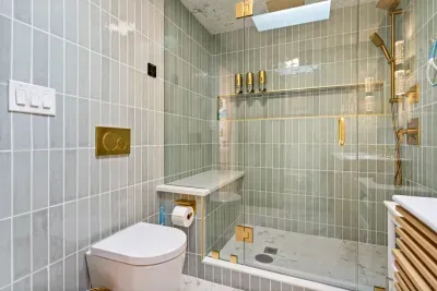 Beautiful master bedroom ensuite bathroom with standing tile shower. Shower also has a steam setting.