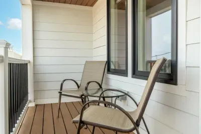 Deck with outdoor seating right off of the master bedroom featuring stunning ocean views.