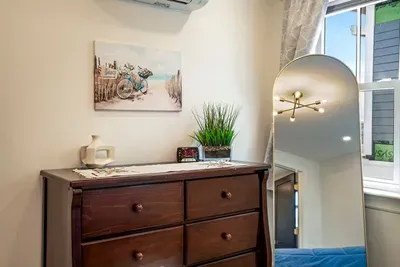 Bedroom #4 features a queen bed, dresser, and full size closet. There is an ensuite bathroom.