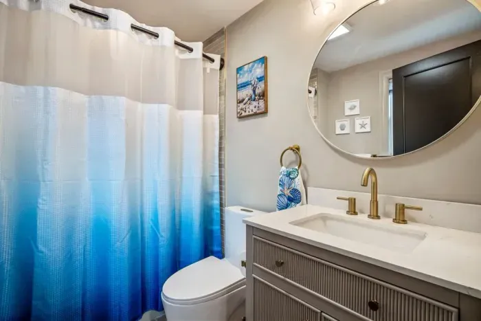 Updated ensuite bathroom off of bedroom #4. Featuring a tub and shower.