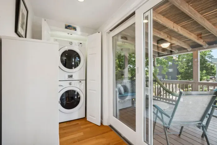 In-unit washer/dryer located off of kitchen area and access to the screened-in deck