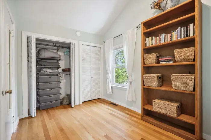 Primary bedroom with queen bed and closet