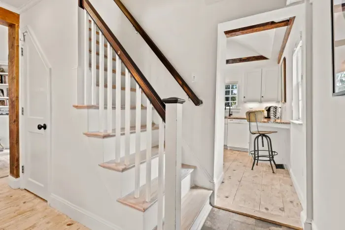 Stairs to access the second floor with 2 bedrooms and full bathroom