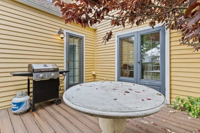 Deck off the main house with gas grill
