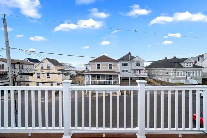 Bedroom #3 (3rd floor) with king bed, flat smart TV, work-from-home desk and balcony facing the ocean.
