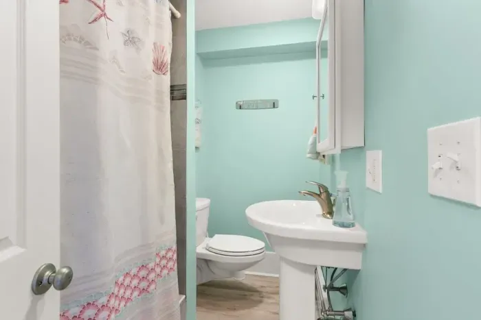 Full bathroom with tiled shower (no tub)