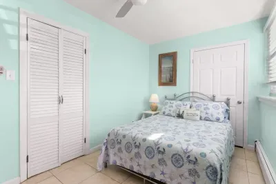 Second of three bedrooms, full-sized bed, beautiful natural light, plenty of closet space and storage.