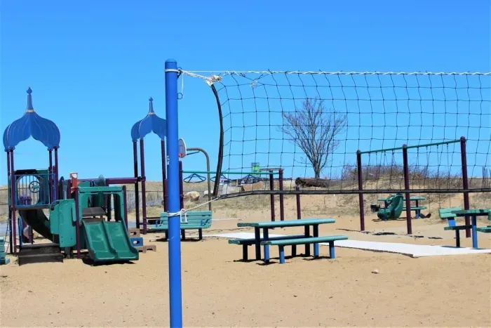 This beach volleyball court, children's playground and 1/2 basketball court is located right outside the back entrance of the rental.