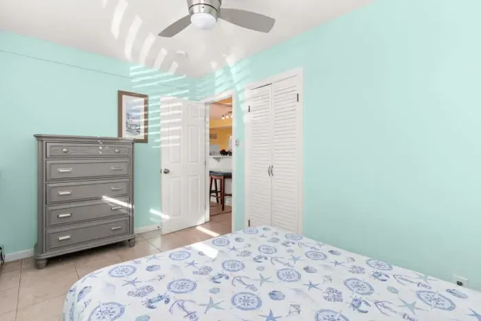 Second of three bedrooms, full-sized bed, beautiful natural light, plenty of closet space and storage.