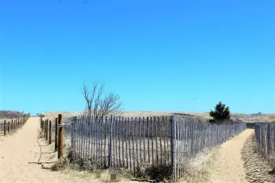Easy public access to and from the beach, just steps away from the rental.