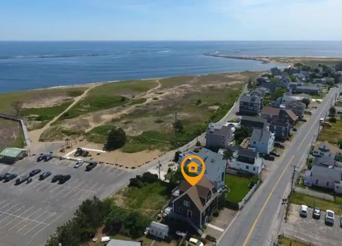 This home is perfectly located on Plum Island -- just steps away from the boardwalk, beach, basin, river and Plum Island lighthouse.
