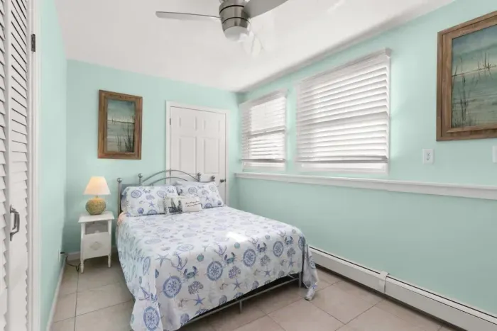 Second of three bedrooms, full-sized bed, beautiful natural light, plenty of closet space and storage.