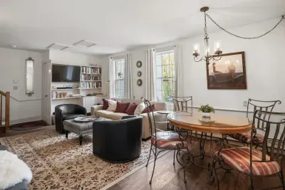 Living room with smart TV, books, games, comfortable seating and strong WiFi. The woodstove is inoperable and not to be used.