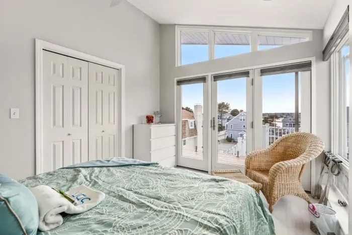 The second bedroom in the penthouse with a queen bed and clean provided linens