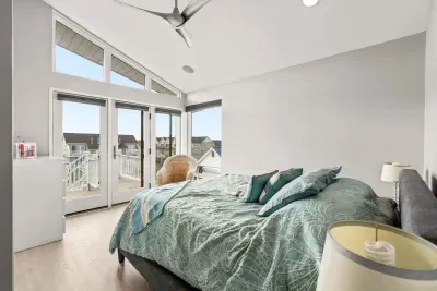 The second bedroom in the penthouse with a queen bed and clean provided linens