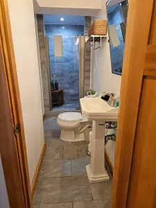 The fully renovated Namaste bathroom with River rock tile! Clean towels provided for all guests.