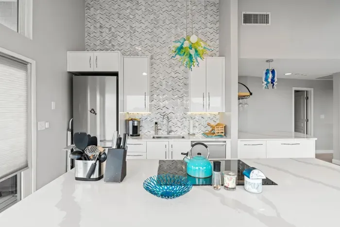 Fully renovated and equipped kitchen with high end Miele appliances, induction stove top, stunning full length backsplash, and seating for 4 at the island (+2 at the peninsula).
