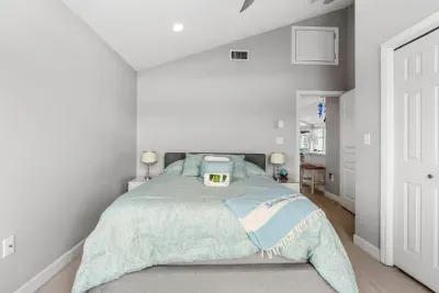 The second bedroom in the penthouse with a queen bed and clean provided linens