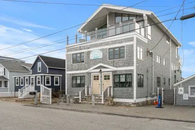The Commonwealth Ave side of the building. Parking for 2 cars in front of the rope. Please leave the parking in front of the cottage for the owner.