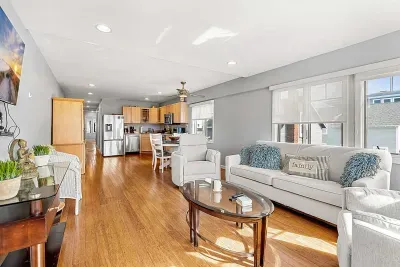 The Nautical Unit - Featuring a large living room with a comfy couch and a smart TV