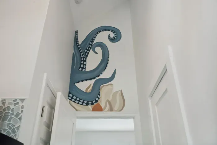 Beautiful beach themed murals throughout done by a local artist!