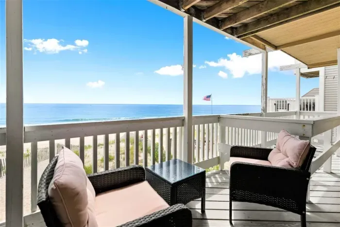 Private deck with outdoor seating, perfect for a morning coffee or afternoon drink (patio furniture not available Nov-Mar)