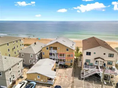 Oceanfront condo (re-sided to gray as of September 2023) with water views, condo located on 2nd level