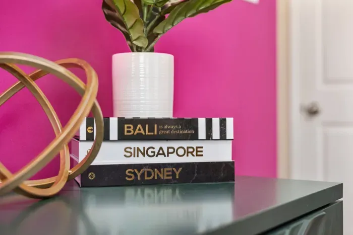 Open kitchen, living room and dining area with smart TV and doors leading to private patio