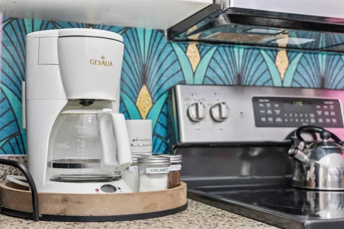 Coffee & tea station with Keurig coffee maker, drip coffee maker, and tea kettle.