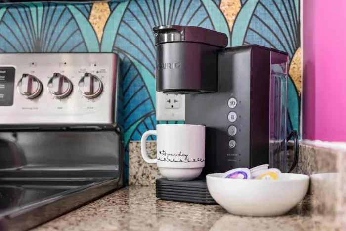 Coffee & tea station with Keurig coffee maker, drip coffee maker, and tea kettle.