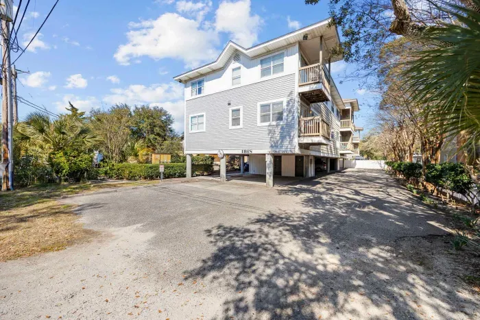 Front, street view, of the IBIS Condominiums, just a half block to the beach with covered garage parking.