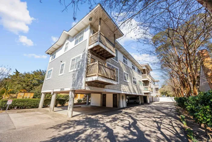 Front, street view, of the IBIS Condominiums, just a half block to the beach with covered garage parking.