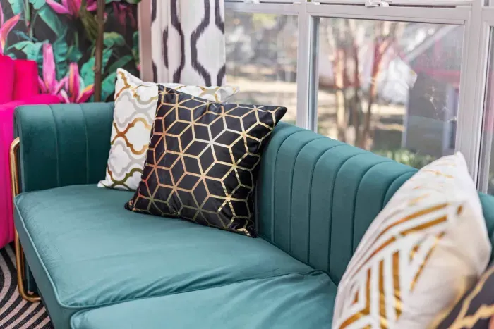 Open kitchen, living room and dining area with smart TV and doors leading to private patio