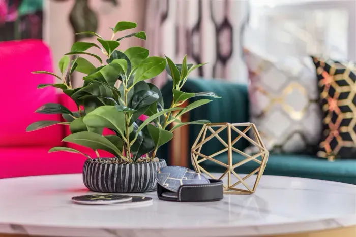 Open kitchen, living room and dining area with smart TV and doors leading to private patio